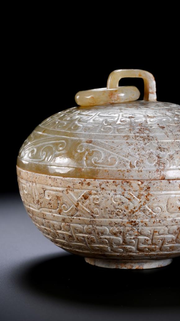 SEAVIEW AUCTIONS PTY LTDA Round White Jade Covered Box with Movable Ring Knob and Archaic Floral Scroll Carvings, 2nd BCE–3rd CE