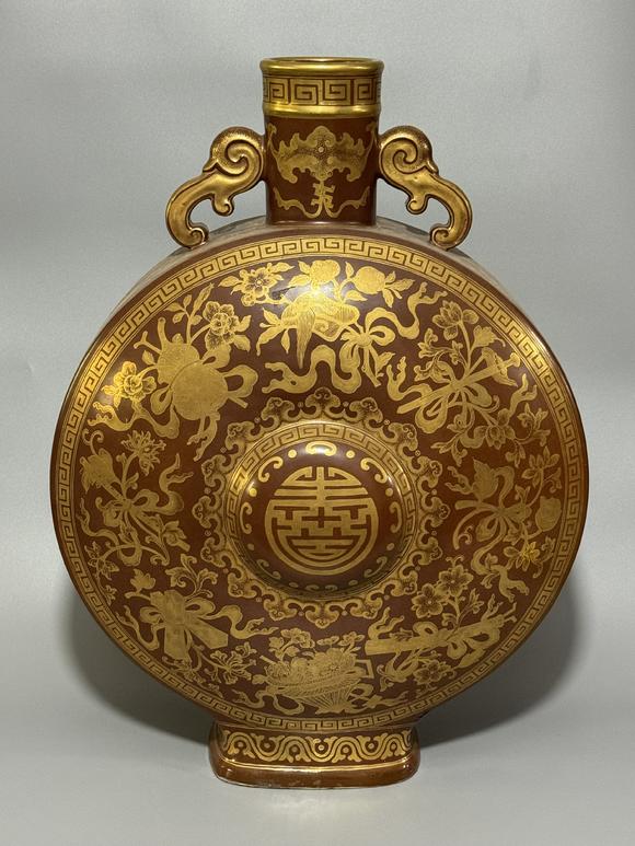 SEAVIEW AUCTIONS PTY LTDA Brown-Ground Gilt Moon Flask with Twin Ruyi Handles, Eight Treasures and Longevity Character Motifs, China, 18th century