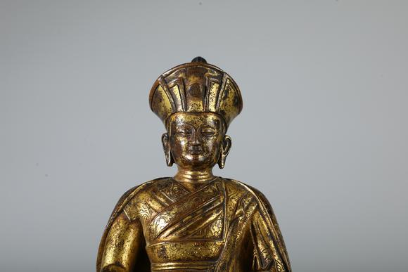 SEAVIEW AUCTIONS PTY LTDA Gilt Bronze Seated Lama Buddha Statue on Double Lotus Base, China, 18th CE