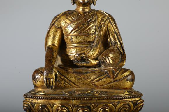 SEAVIEW AUCTIONS PTY LTDA Gilt Bronze Seated Lama Buddha Statue on Double Lotus Base, China, 18th CE