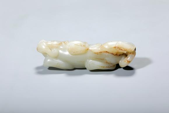 SEAVIEW AUCTIONS PTY LTDA Russet-Inclusion White Jade Recumbent Chilong Dragon, China, 2nd–1st centuries BCE