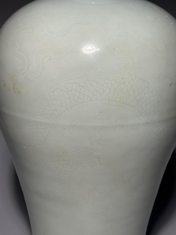 SEAVIEW AUCTIONS PTY LTDA White Porcelain Meiping Vase with Incised Dragon and Cloud Patterns, China, 18th century