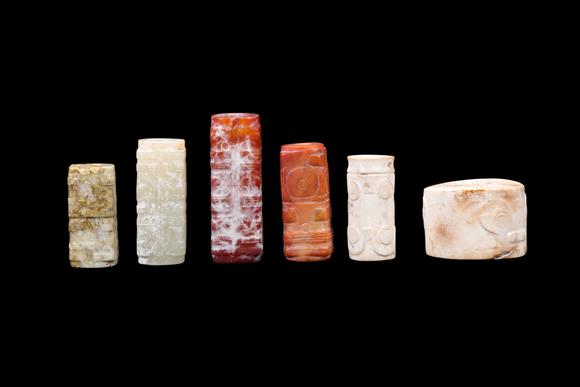 Castle AuctionA Group of Six Calcified & Reddish Jade Cong-Style Beads, Liangzhu, Circa 3300–2300 C BC Pr.