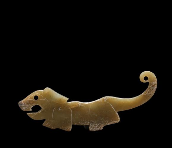Castle AuctionA Calcified Yellow Jade Tiger-form Pendant, Western Zhou, Circa 10th–9th C BC Pr.
