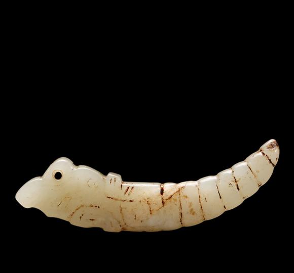 Castle AuctionA White Jade Silkworm Pendant with Russet Veins, Western Zhou, Circa 10th–8th C BC Pr.