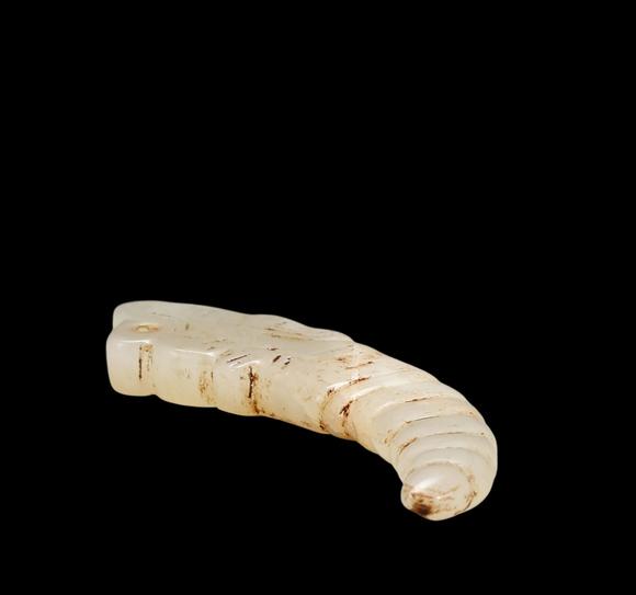 Castle AuctionA White Jade Silkworm Pendant with Russet Veins, Western Zhou, Circa 10th–8th C BC Pr.
