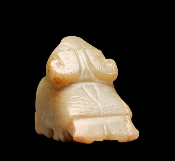 Castle AuctionA Pale Calcified Jade Recumbent Bird Carving, Late Shang, Circa 12th–11th C BC Pr.