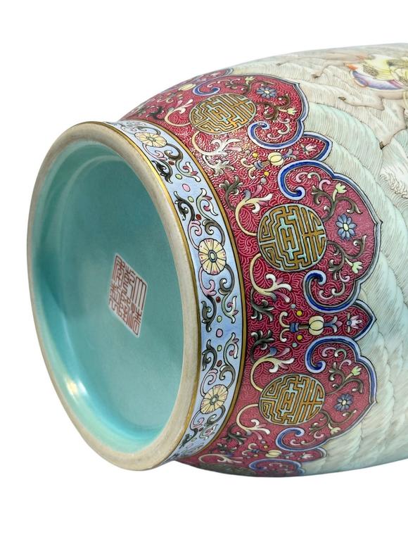 Castle AuctionA Chinese Rouge Famille Rose vase adorned with the Eight Immortals' figures pattern, together with A Chinese porcelain stand, Qian Long Pr. 
