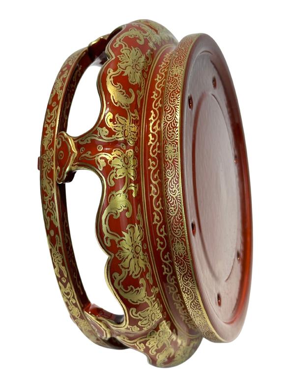 Castle AuctionA Chinese Rouge Famille Rose vase adorned with the Eight Immortals' figures pattern, together with A Chinese porcelain stand, Qian Long Pr. 