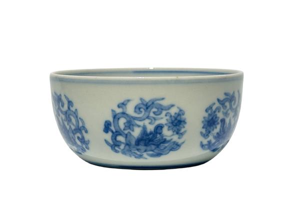 Castle AuctionA Chinese blue-and-white round chi dragon patterned reclining foot cup, Ming Dynasty Pr. 