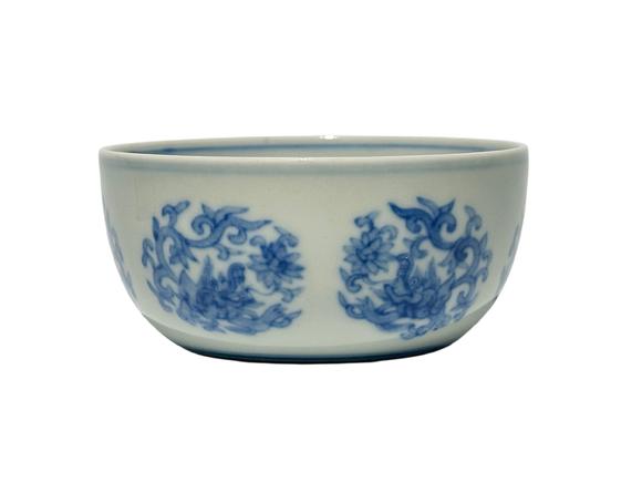Castle AuctionA Chinese blue-and-white round chi dragon patterned reclining foot cup, Ming Dynasty Pr. 