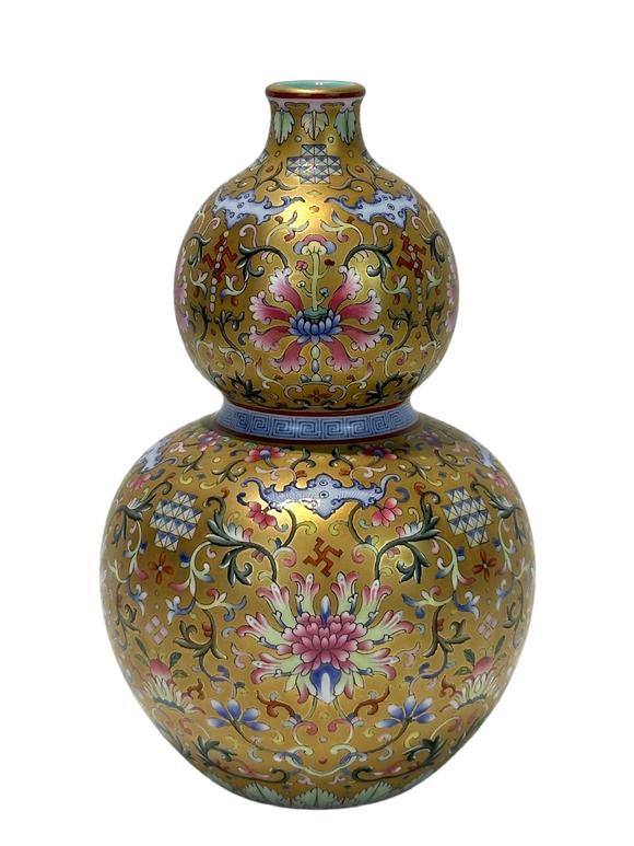 Castle AuctionA Chinese Famille Rose gilt gourd type vase, Qian Long Pr. 