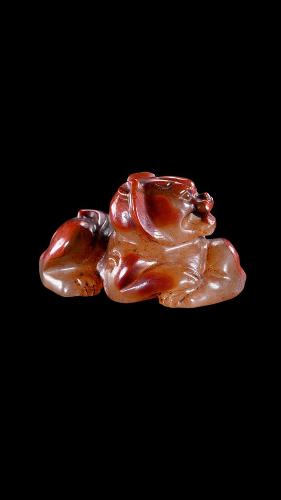 Castle AuctionA Reddish Jade Mythical Beast Carving, Han, Circa 2nd C BC–2nd C AD Pr.