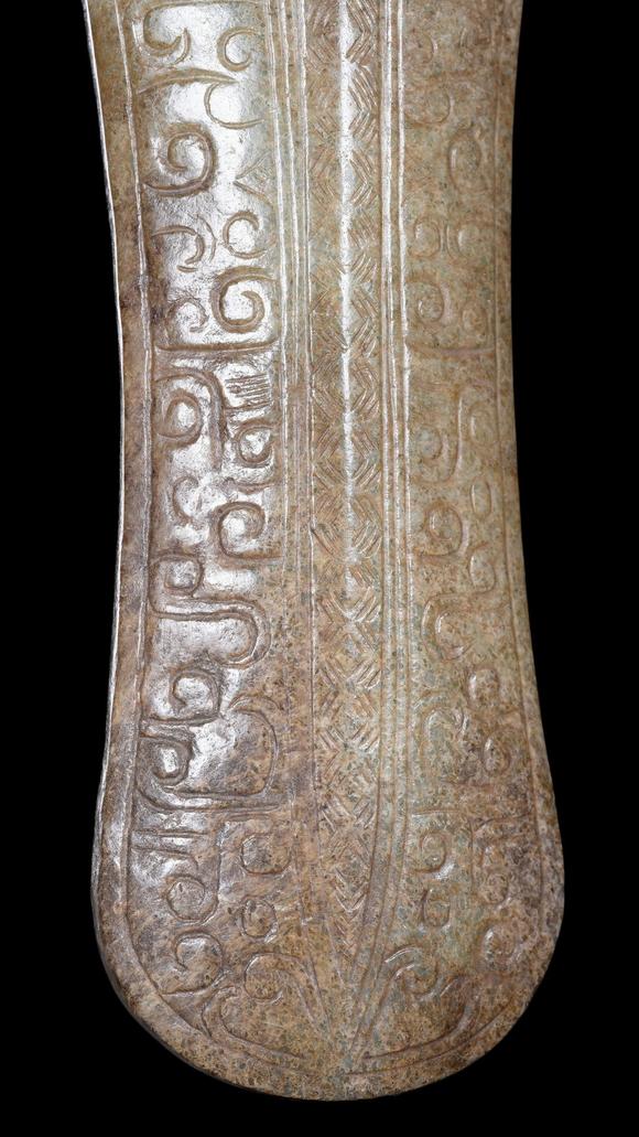 Castle AuctionA Calcified Pale Jade Ox-Headed Plaque, Western Zhou, Circa 10th–9th C BC Pr.