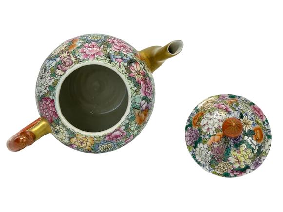 Castle AuctionThe famille rose and flowers décor teapot, Qian Long Pr. 