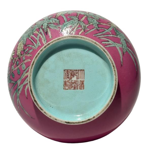 Castle AuctionA Chinese rouge-red ground famille rose vase, Qian Long Pr. 