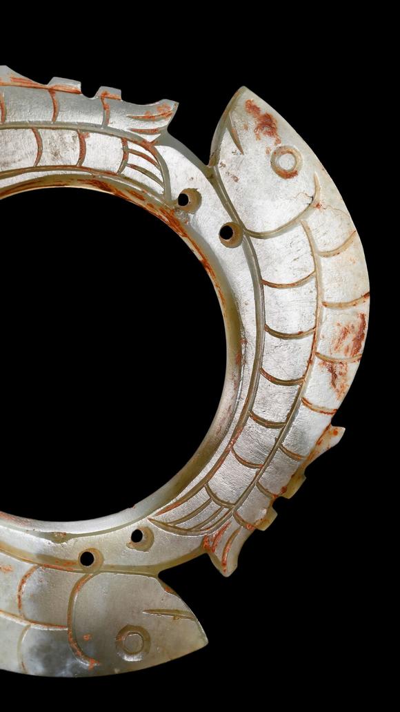 Castle AuctionA Pale Jade Dragon-Ring Pendant with Red Pigment Traces, Han, Circa 2nd C BC–2nd C AD Pr.