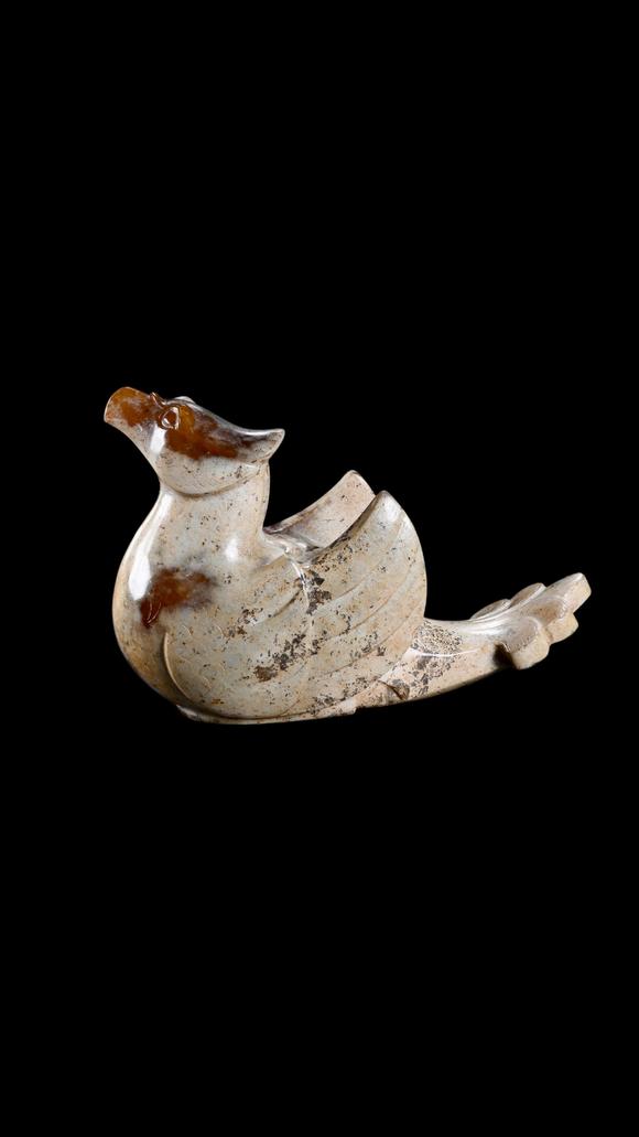 Castle AuctionA Calcified White Jade Phoenix Carving with Russet Inclusions, Han, Circa 2nd C BC–2nd C AD Pr.