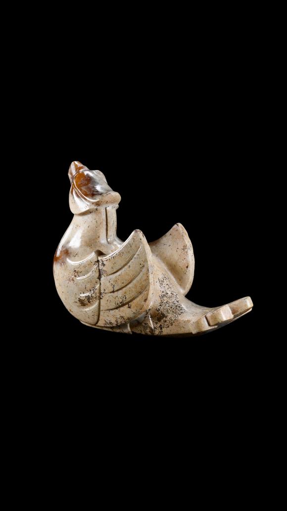 Castle AuctionA Calcified White Jade Phoenix Carving with Russet Inclusions, Han, Circa 2nd C BC–2nd C AD Pr.