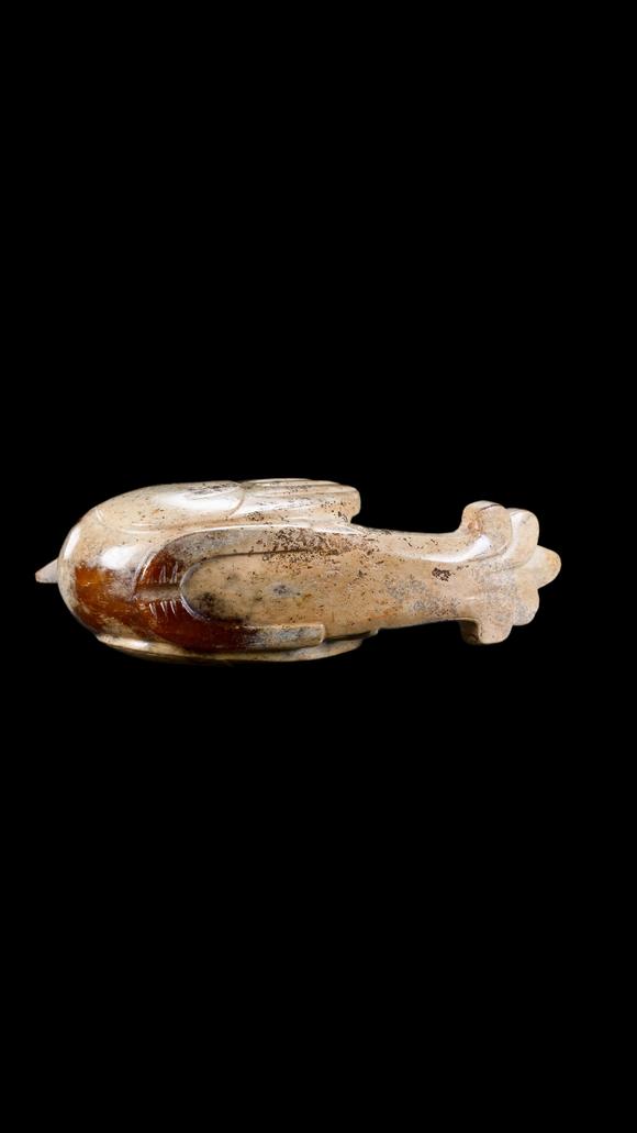 Castle AuctionA Calcified White Jade Phoenix Carving with Russet Inclusions, Han, Circa 2nd C BC–2nd C AD Pr.