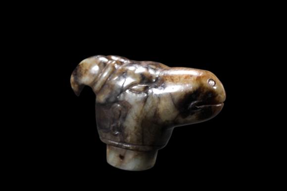 Castle AuctionA Mottled Pale Jade Ram Head Cane Finial, Han, Circa 2nd C BC–2nd C AD Pr.