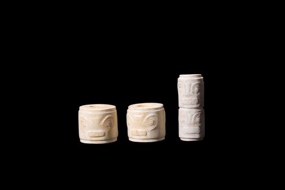 Castle AuctionA Three Calcified White Jade Human-Face Beads, Liangzhu, Circa 3300–2300 C BC Pr.