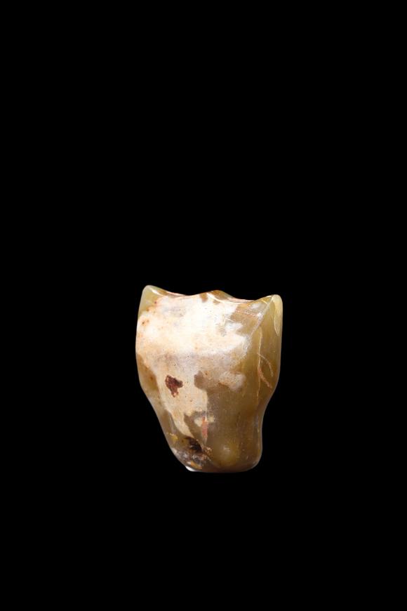 Castle AuctionA Calcified Yellow Jade Tooth-Form Pendant, Shang, Circa 13th–11th C BC Pr.