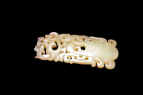 Castle AuctionA Pale Yellow Jade Openwork Dragon Phoenix Plaque, Han, Circa 2nd C BC–2nd C AD Pr.