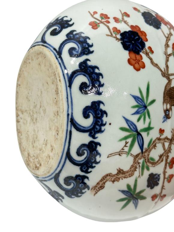 Castle AuctionA Chinese Blue and white moonflask vse with Famille Verte deco, Ming Dynasty Pr. 