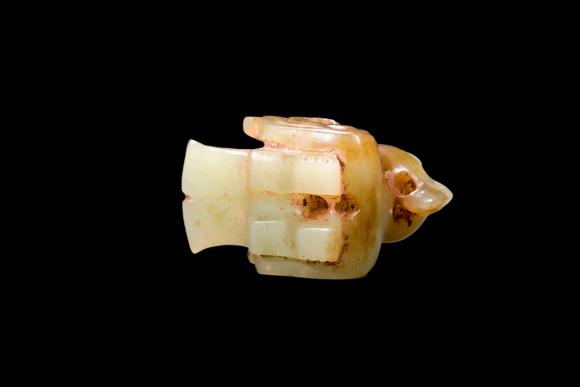 Castle AuctionA Pale Yellow Jade Recumbent Bird Carving, Late Shang, Circa 12th–11th C BC Pr.
