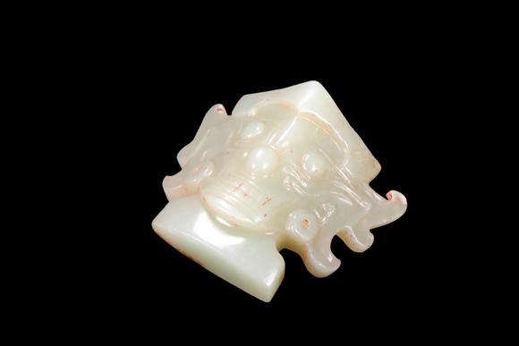 Castle AuctionA Pale Celadon Jade Taotie Mask Pendant, Shang, Circa 13th–11th C BC Pr.