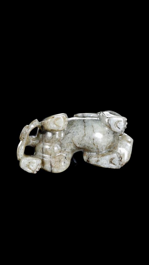 Castle AuctionA Mottled Black & White Jade Crouching Tiger Carving, Han, Circa 2nd C BC–2nd C AD Pr.