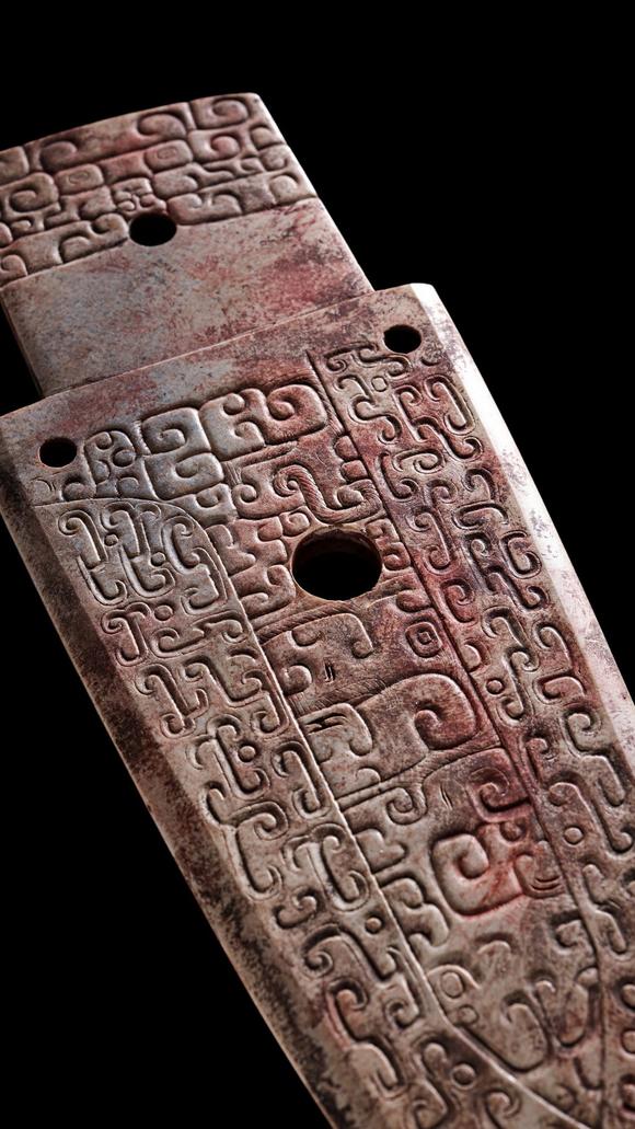 Castle AuctionA Calcified Brown Jade Carved Gui Pendant, Shang, Circa 13th–11th C BC Pr.