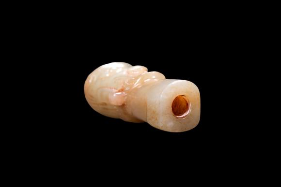 Castle AuctionA Pale Jade Human Head Bead with Russet Inclusions, Shang, Circa 13th–11th C BC Pr.