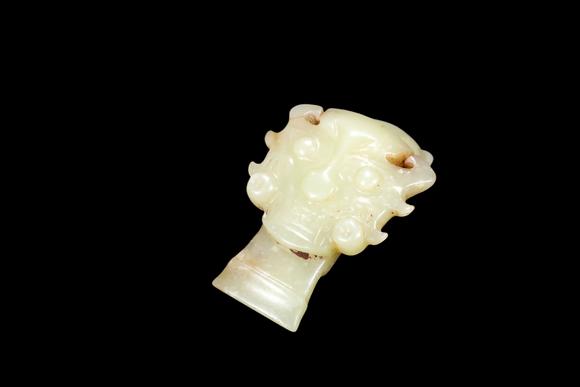 Castle AuctionA Pale Yellow Jade Human Mask Pendant, Shang, Circa 13th–11th C BC Pr.