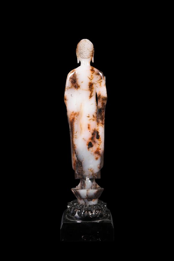 Castle AuctionA White Jade Standing Buddha Statue with Russet Inclusions, Tang, Circa 618–907 AD Pr.