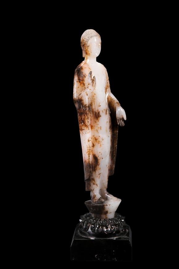 Castle AuctionA White Jade Standing Buddha Statue with Russet Inclusions, Tang, Circa 618–907 AD Pr.