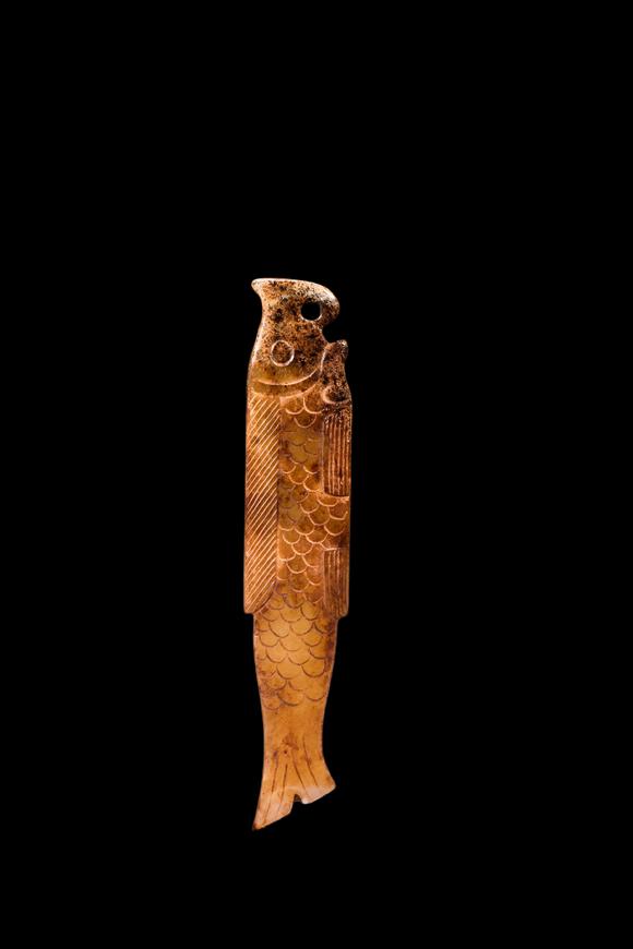 Castle AuctionA Calcified Yellow Jade Fish Pendant, Shang, Circa 13th–11th C BC Pr.