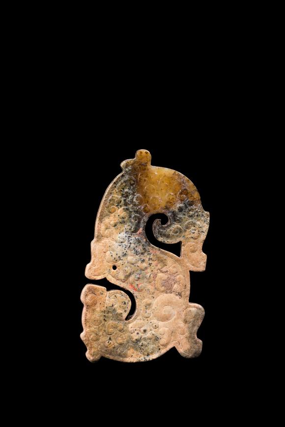 Castle AuctionA Mottled Calcified Jade S-Shaped Dragon Plaque, Spring & Autumn, Circa 8th–5th C BC Pr.