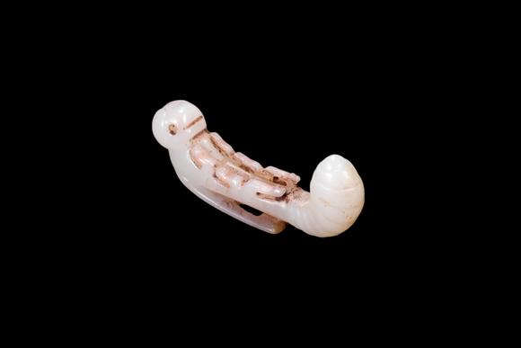 Castle AuctionA White Jade Silkworm Pendant with Russet Veins, Western Zhou, Circa 10th–8th C BC Pr.