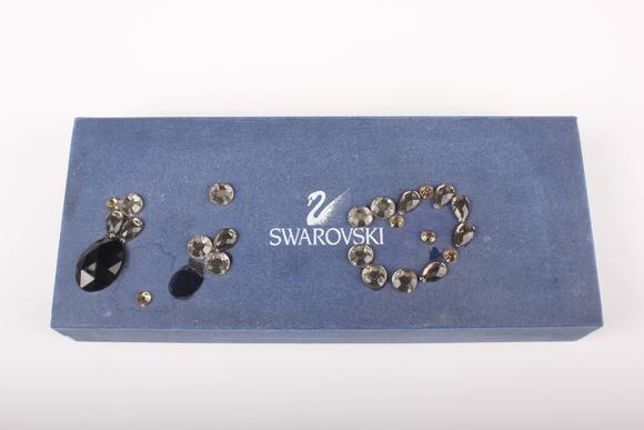 TooveysA small group of jewellery, comprising a 9ct gold ring in a bead and ropetwist design, weight 1.6g, ring size approx M1/2, a Swarovski gilt metal and