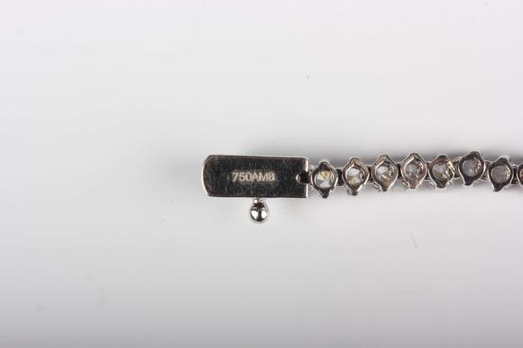 TooveysA white gold and colourless cubic zirconia demi-parure, comprising a graduated necklace and bracelet, each mounted with circular cut colourless cubic