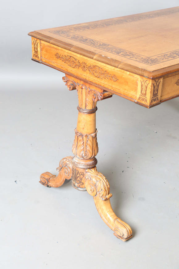 TooveysA Regency bird’s eye maple and foliate inlaid library table, in the manner of Gillows of Lancaster, the moulded top above two frieze drawers, twin su