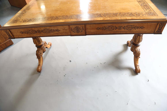 TooveysA Regency bird’s eye maple and foliate inlaid library table, in the manner of Gillows of Lancaster, the moulded top above two frieze drawers, twin su