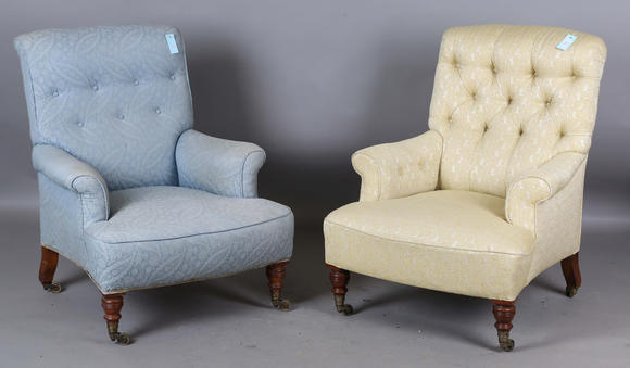 TooveysA near pair of late Victorian Howard & Sons armchairs, each buttoned back above scroll arms, on turned walnut legs with gilt brass caps and castors, e