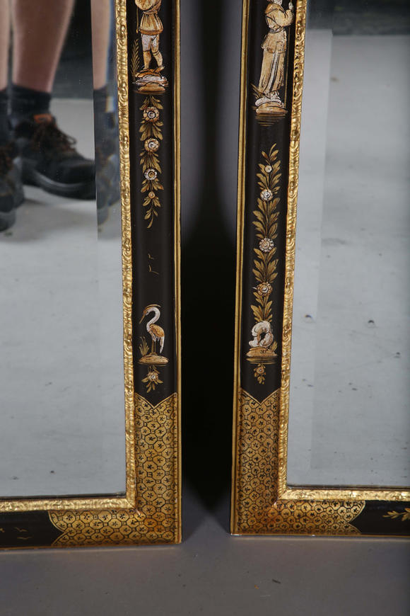 TooveysAn impressive pair of early 20th century Queen Anne style gilt and black japanned pier mirrors, each shaped crest with central shell and griffon heads
