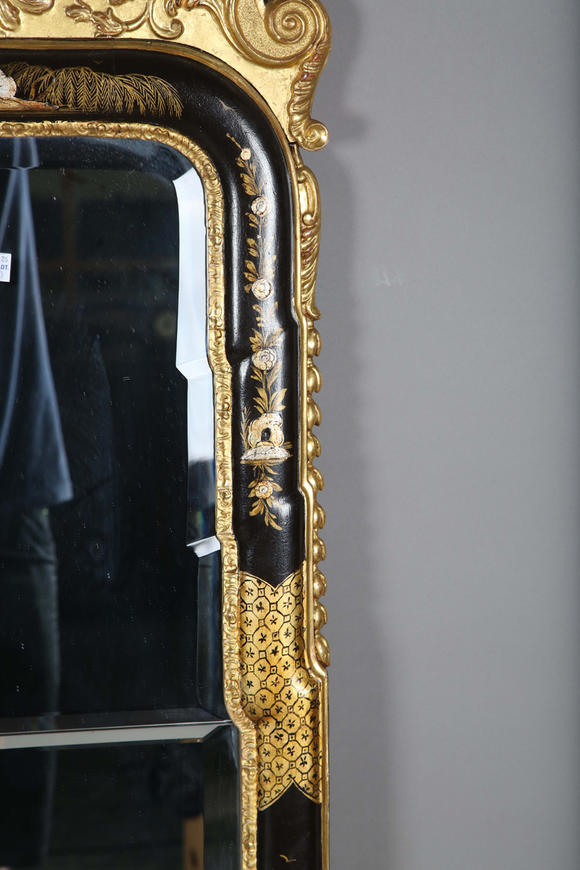 TooveysAn impressive pair of early 20th century Queen Anne style gilt and black japanned pier mirrors, each shaped crest with central shell and griffon heads
