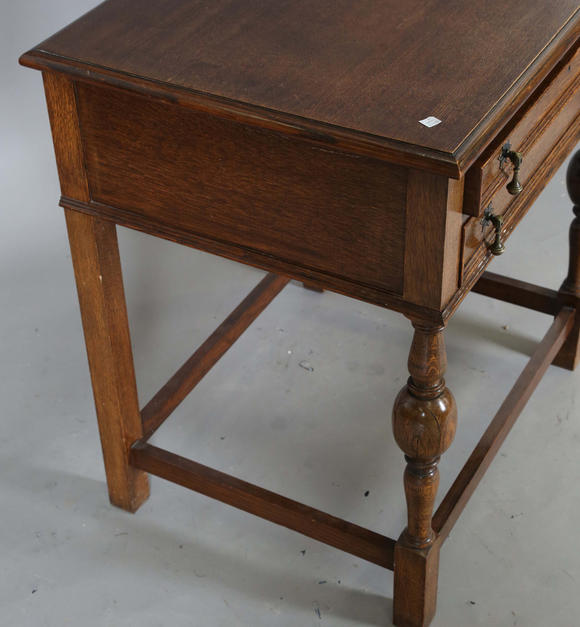 TooveysA George V oak two-drawer side table, height 77cm, width 71cm, depth 56cm.