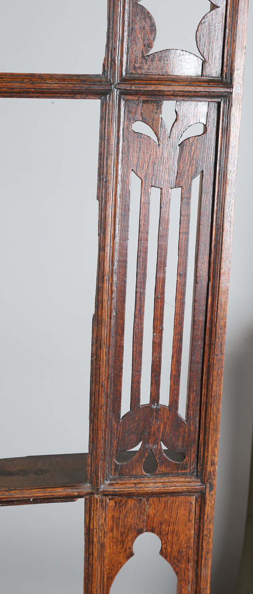 TooveysA good George III North Country oak dresser, the plate rack with pierced side panels above a lappet carved frieze and an arrangement of nine drawers,