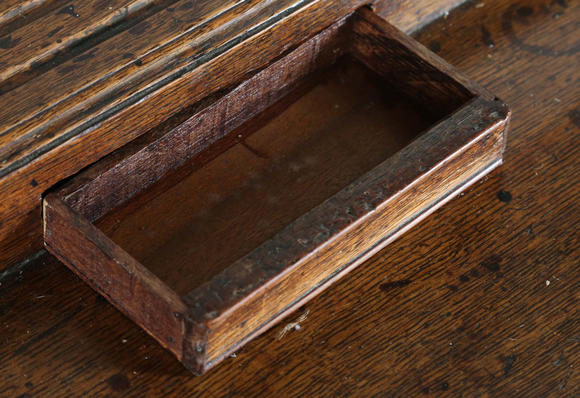 TooveysA good George III North Country oak dresser, the plate rack with pierced side panels above a lappet carved frieze and an arrangement of nine drawers,